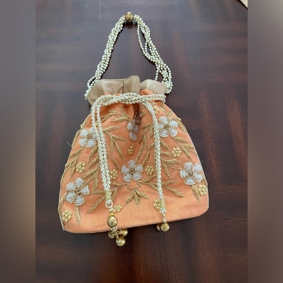 Women’s Luxuries Pearl &glass beads embellished potli bags in peach color - Picture 1 of 7
